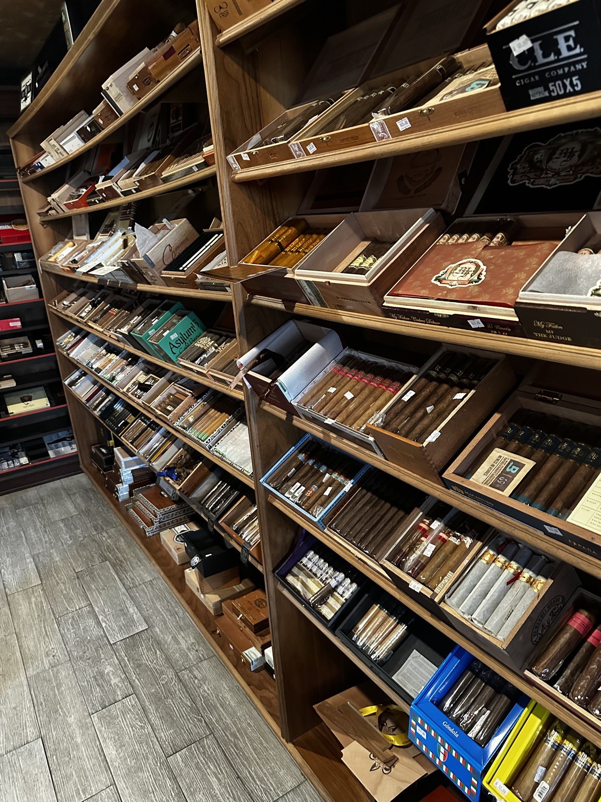 Humidor wall stocked with cigar boxes
